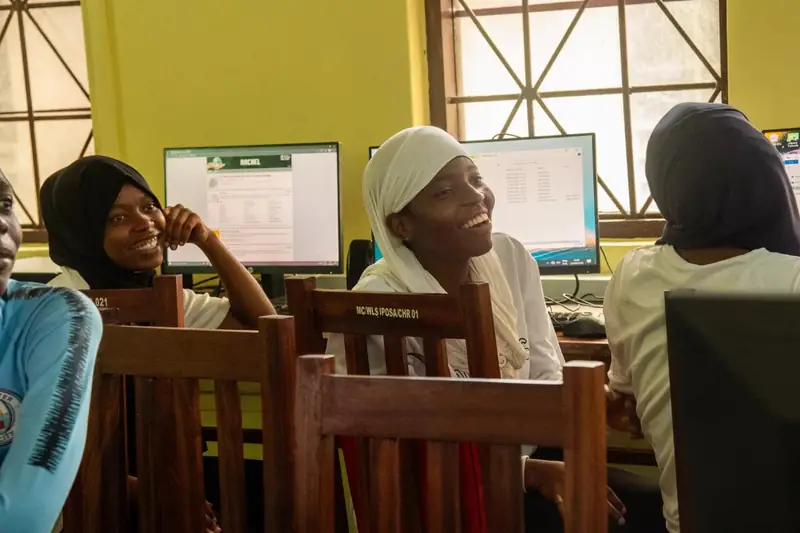 Young Tanzanian women taking part in digital skills training